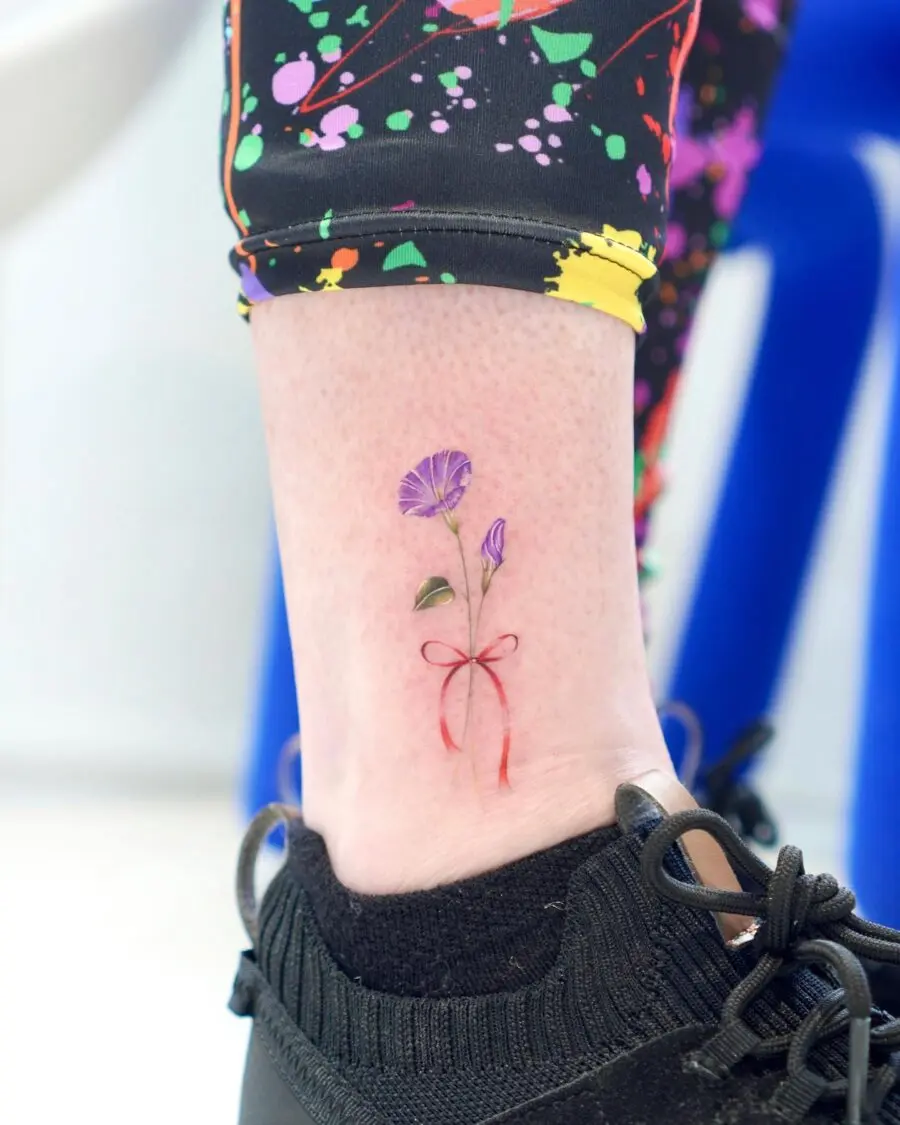 Vibrant Petunia Tattoo with Bow Detailing