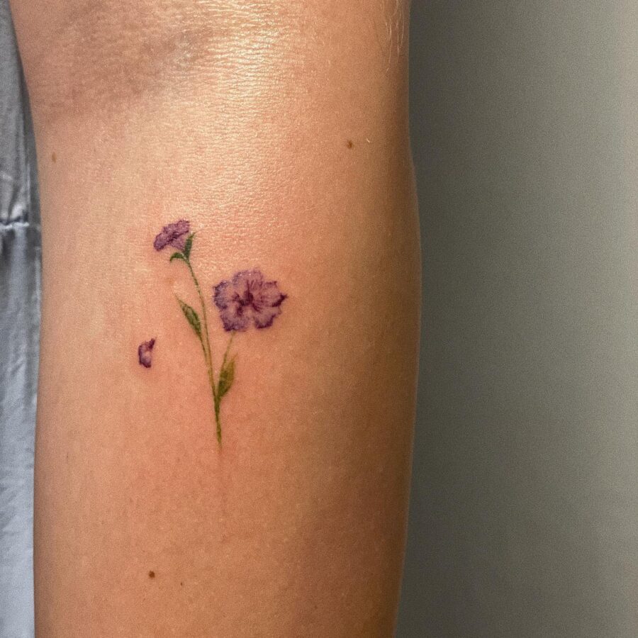 Delicate petunia tattoo on the arm
