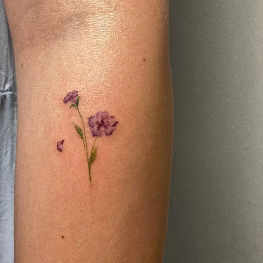 Delicate petunia tattoo on the arm