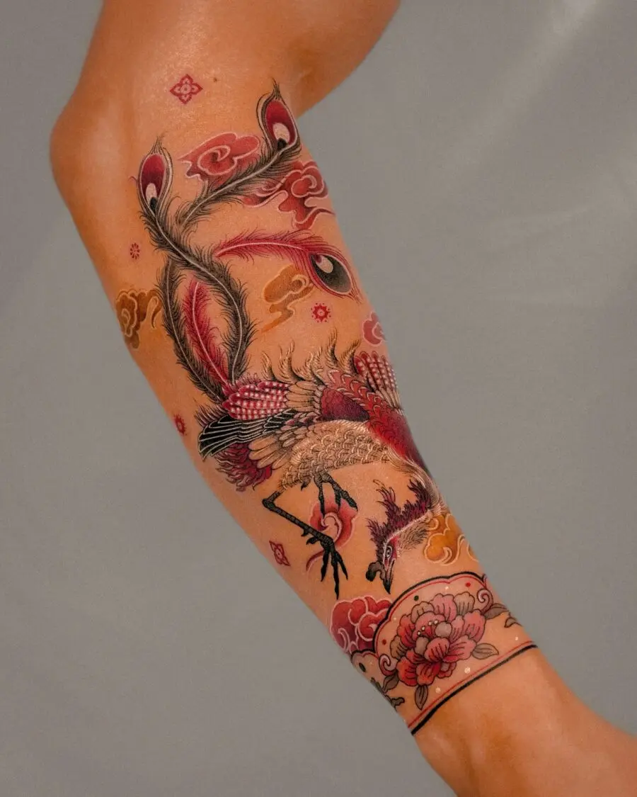 Vibrant half sleeve tattoo featuring a phoenix