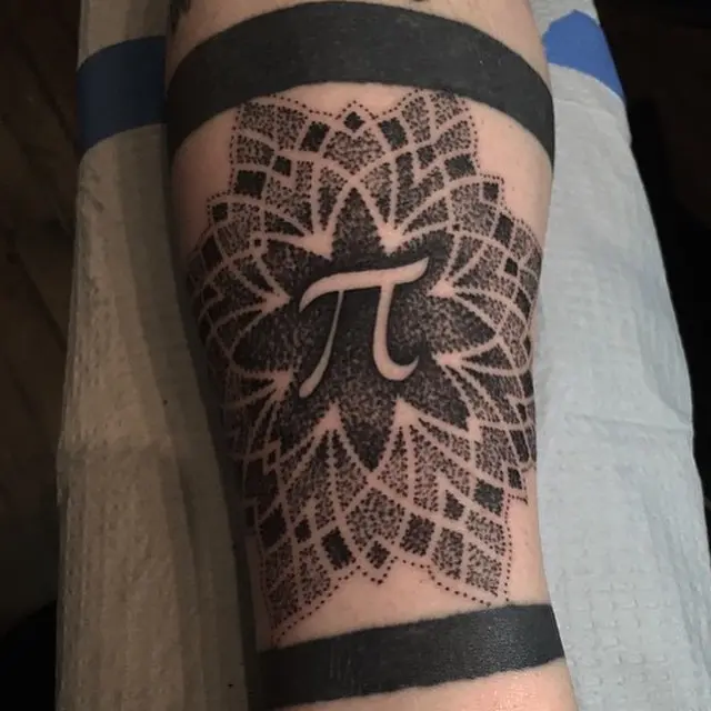 Intricate lace pi tattoo with floral details