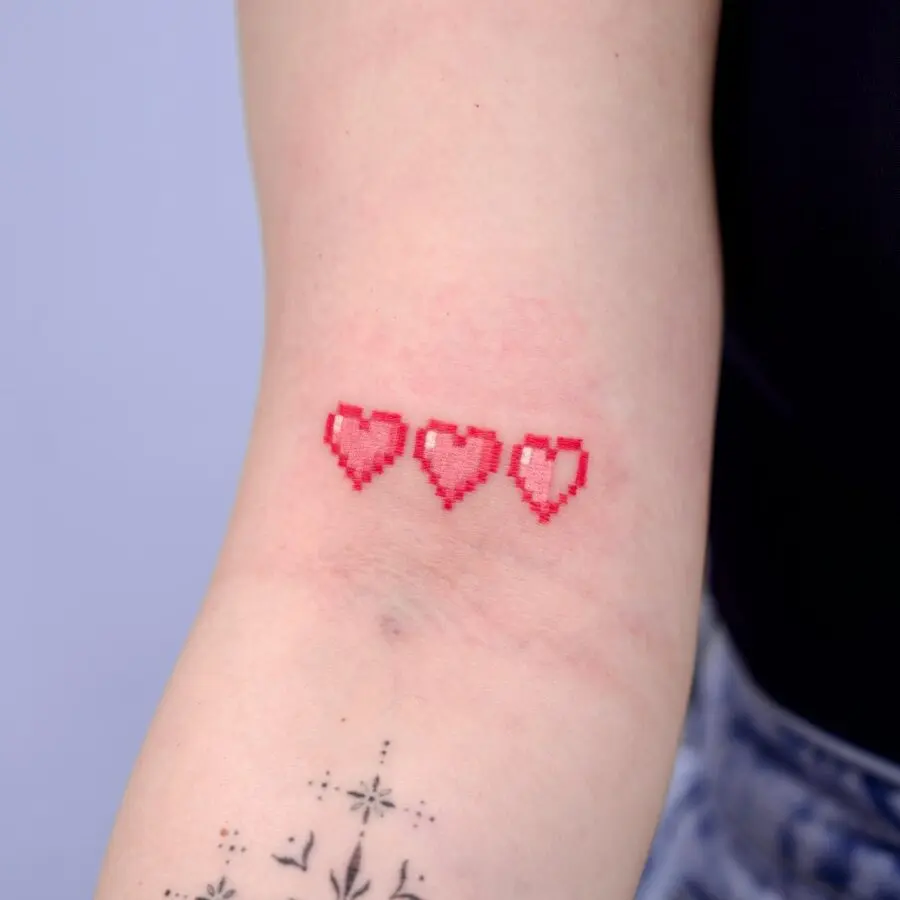 Charming pixelated candy heart tattoo design