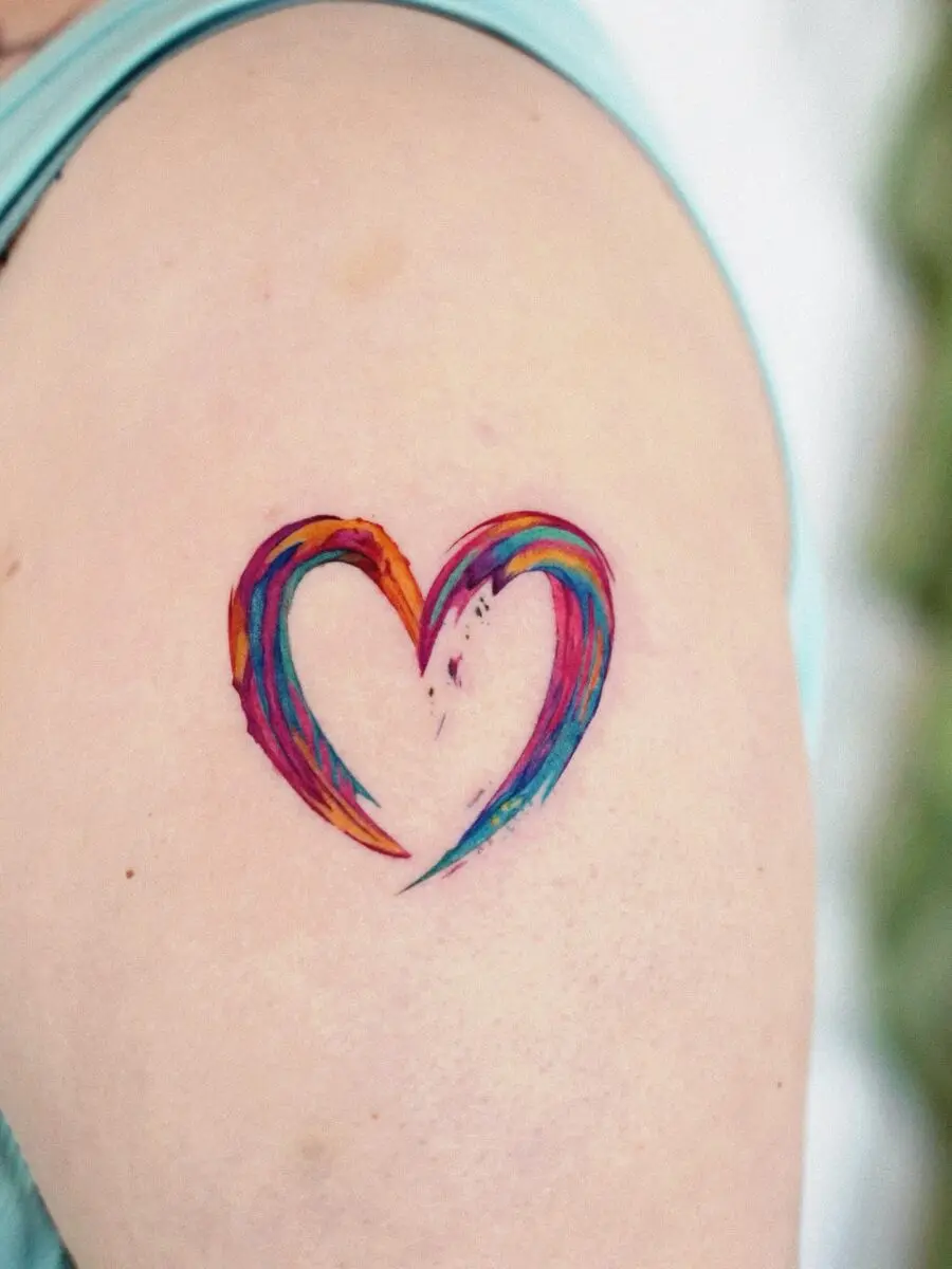 A vibrant heart tattoo celebrating rainbow babies