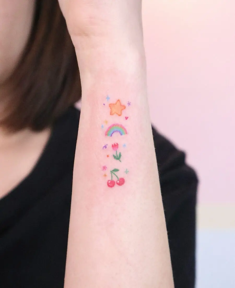 Charming rainbow baby tattoo with playful elements