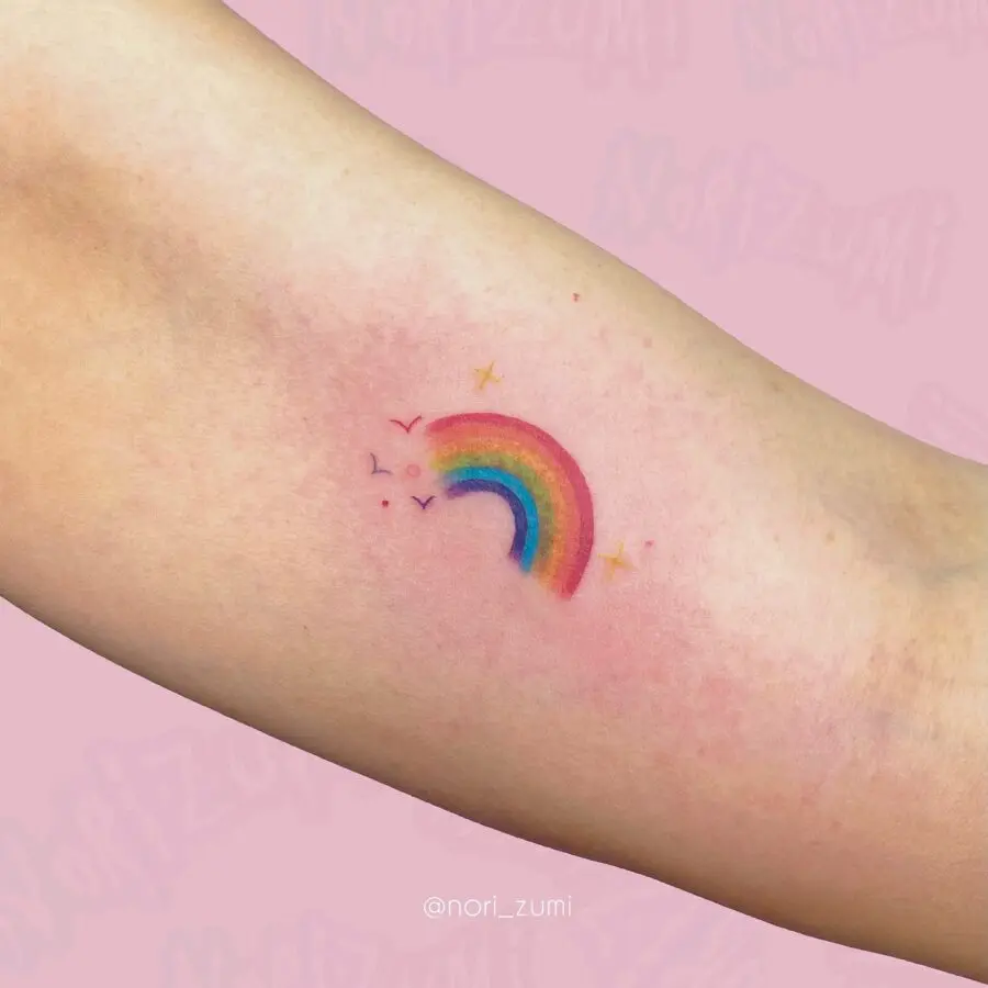 Charming rainbow tattoo celebrating new beginnings