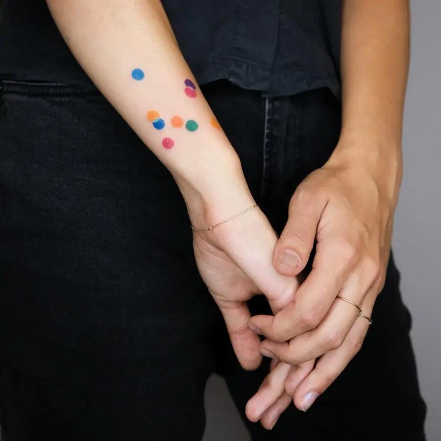 Colorful dot tattoos symbolizing joy and remembrance