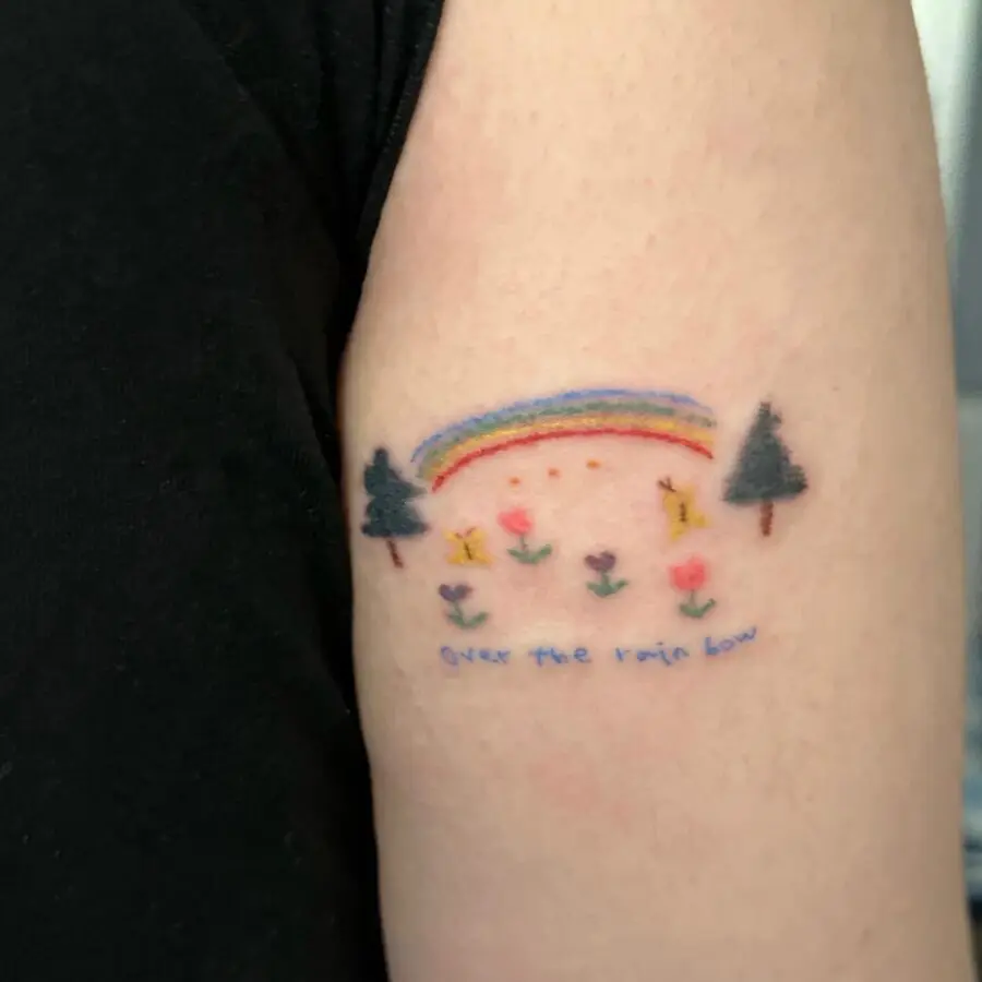 Whimsical rainbow baby tattoo design inspiration