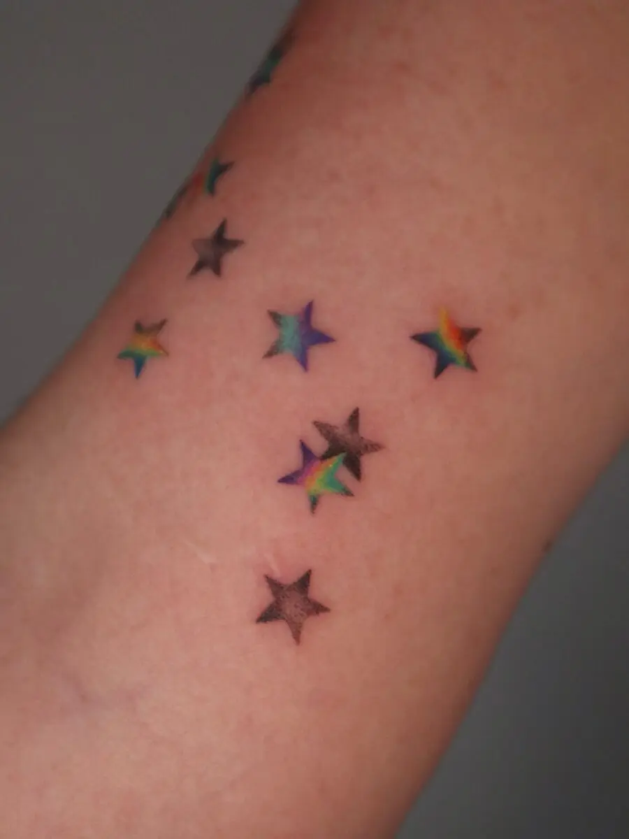 Symbolic colorful stars represent rainbow babies