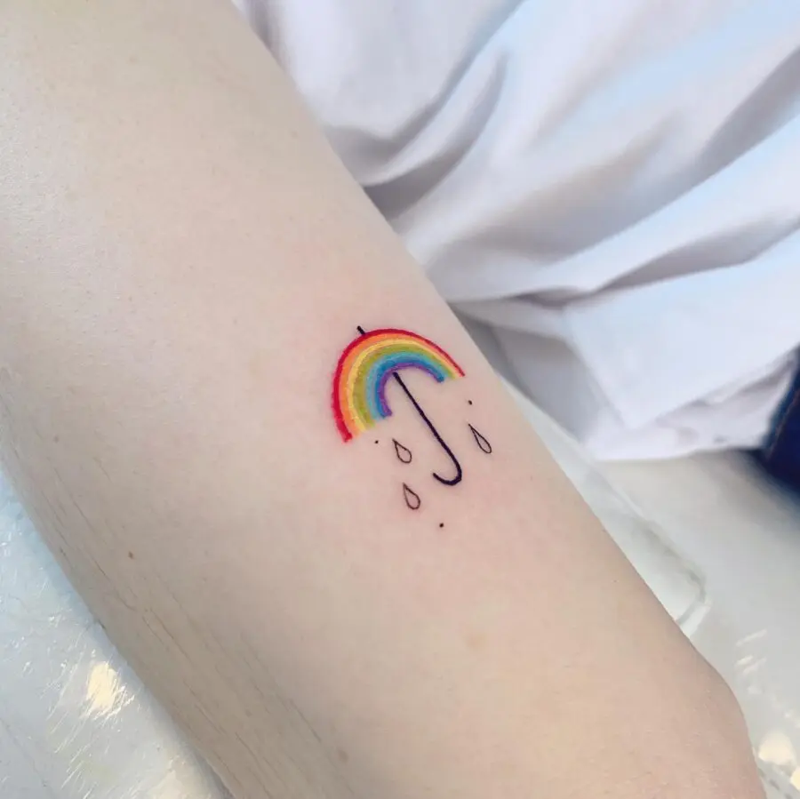 Vibrant rainbow umbrella tattoo for remembrance
