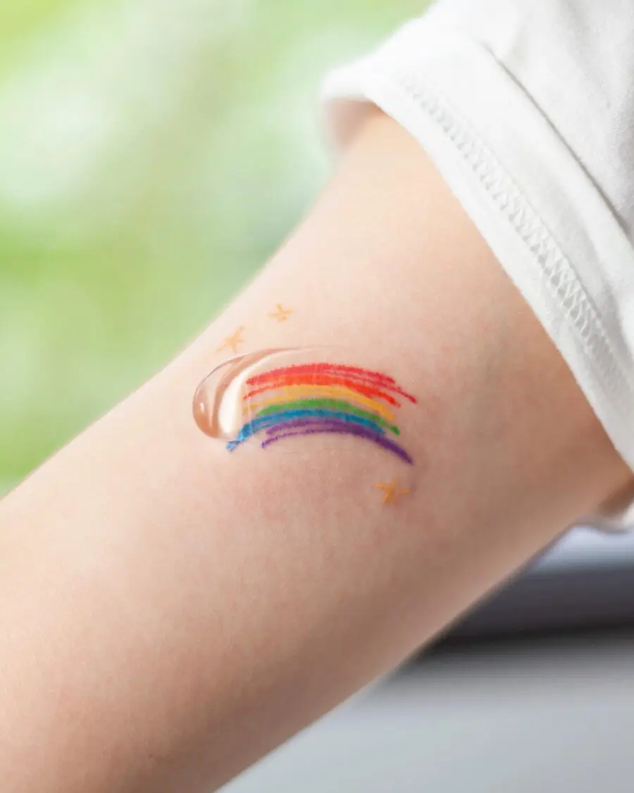 Vibrant Rainbow Baby Tattoo on Child's Arm
