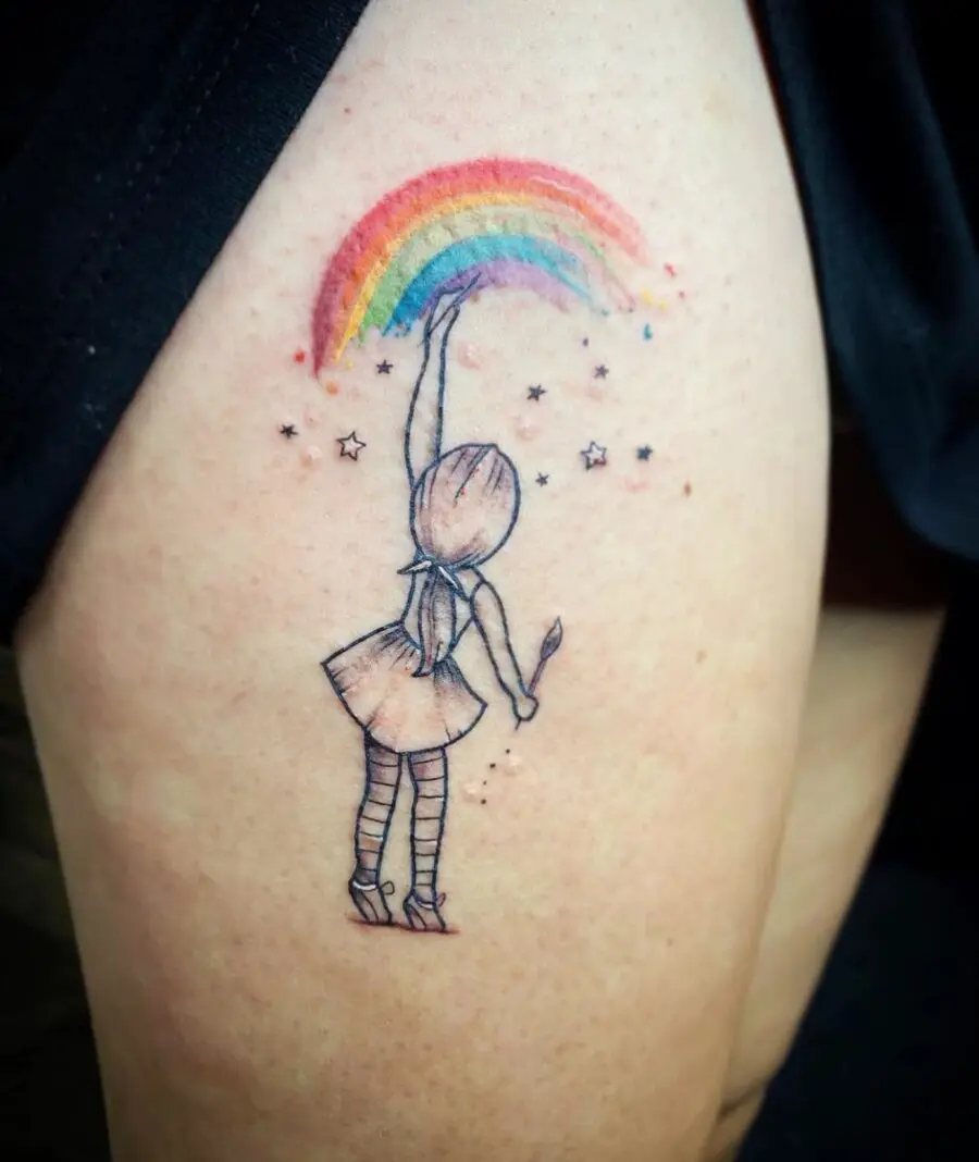 Whimsical rainbow baby tattoo featuring a girl