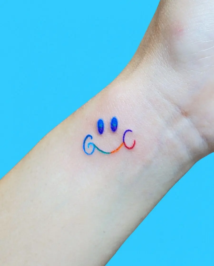 Vibrant Smiley Rainbow Baby Tattoo Design