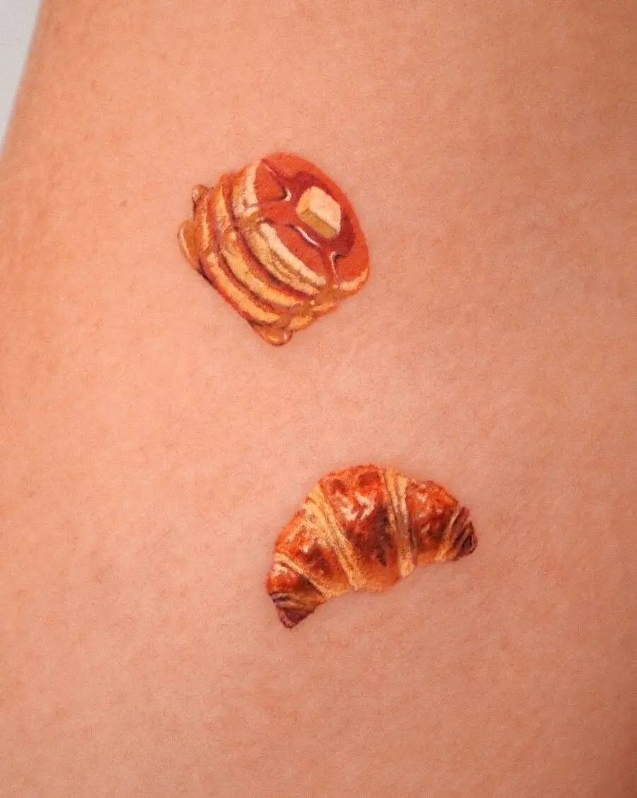 Charming and vibrant croissant tattoo designs