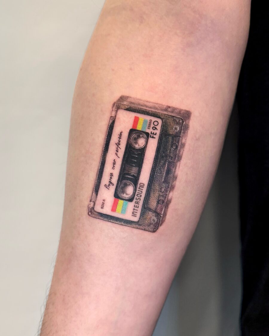 Unique cassette tattoo on forearm.