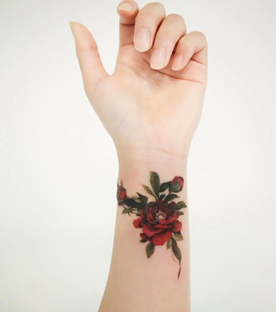 Vibrant floral wrist tattoo with intricate details