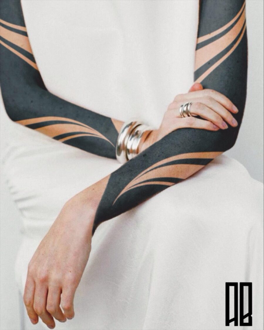 Stylish Black Sleeve Tattoo with Smooth Lines
