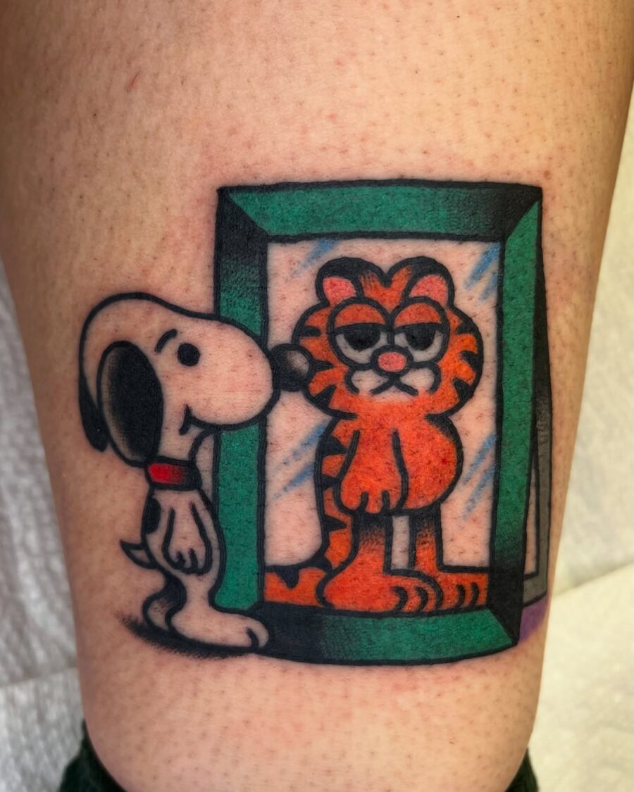 Snoopy and Garfield in a playful tattoo