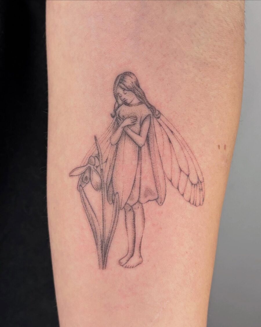 Elegant snowdrop fairy tattoo design inspiration