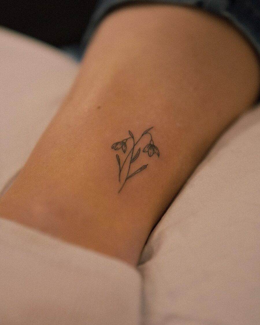 Delicate snowdrop tattoo on elegant skin