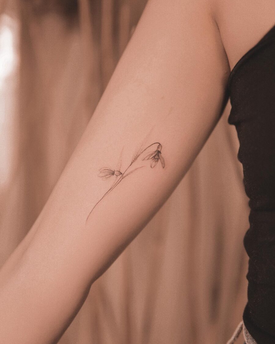 Elegant snowdrop tattoo inspiring subtle beauty