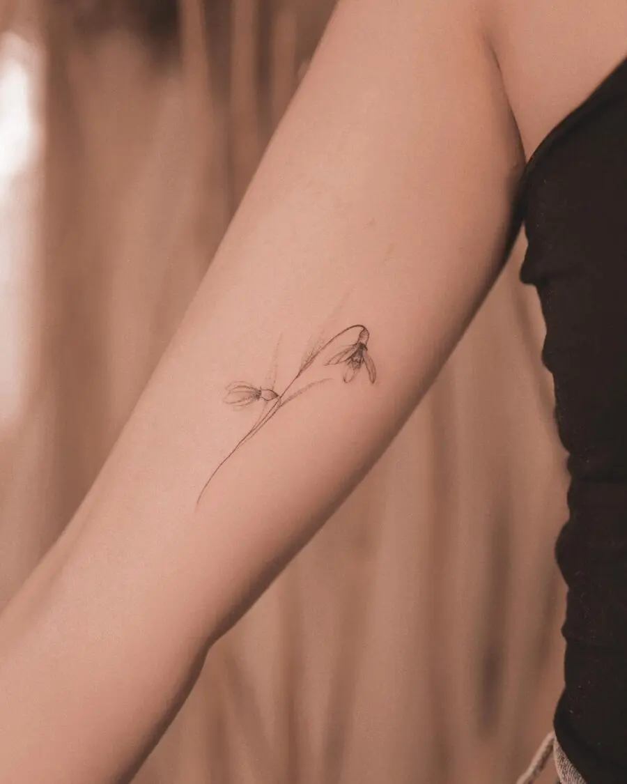 Elegant snowdrop tattoo inspiring subtle beauty