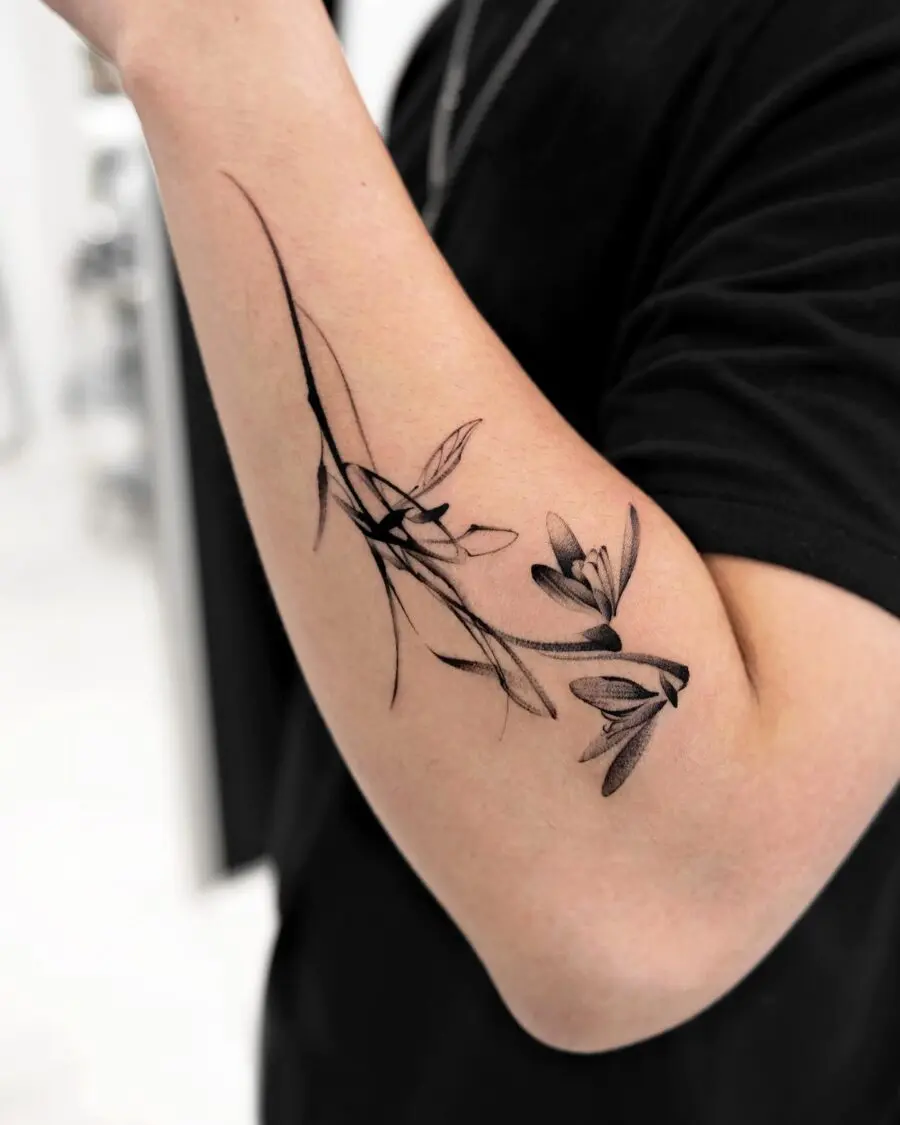 Elegant snowdrop tattoo showcasing delicate artistry