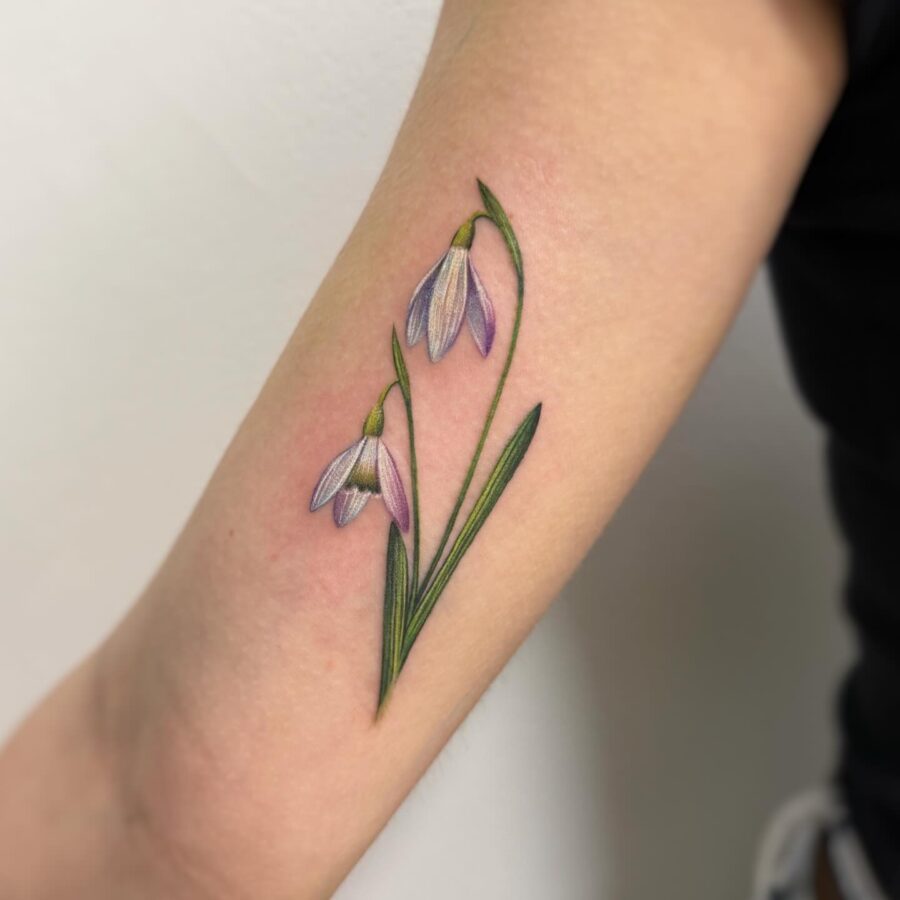 Beautiful snowdrop tattoo with delicate blooms