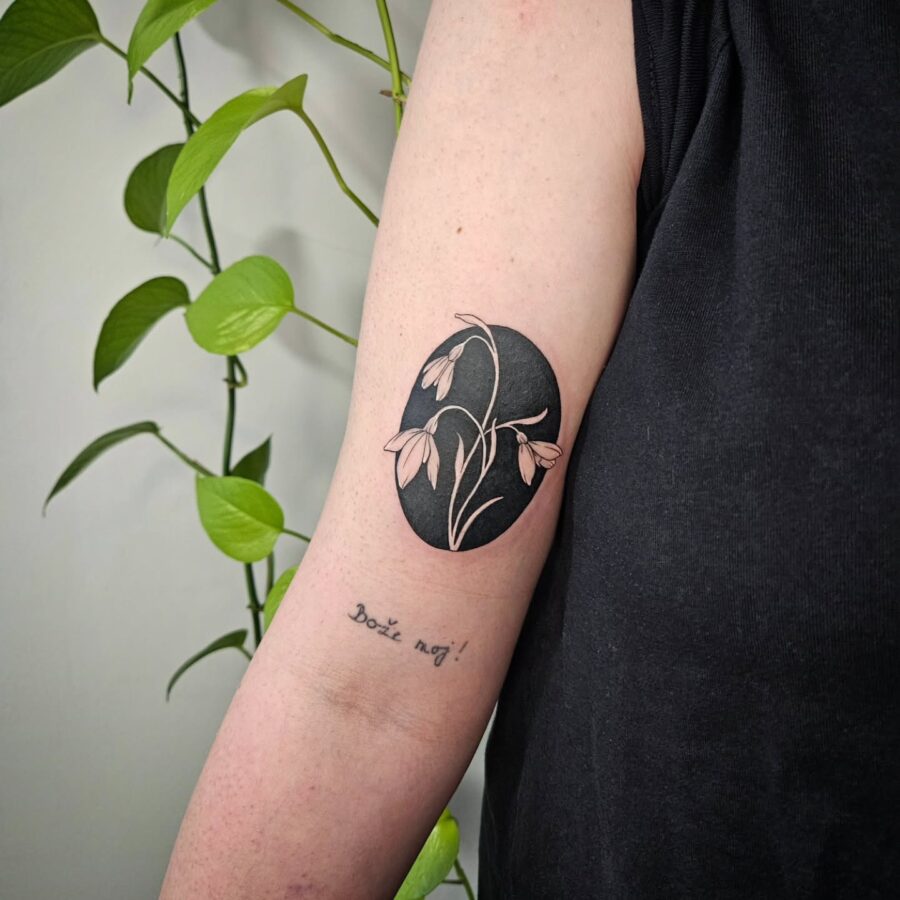 Elegant snowdrop tattoo with intricate details