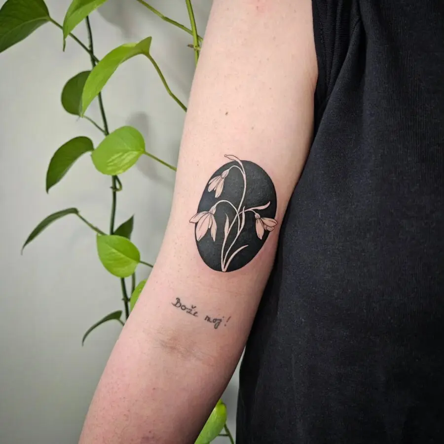 Elegant snowdrop tattoo with intricate details