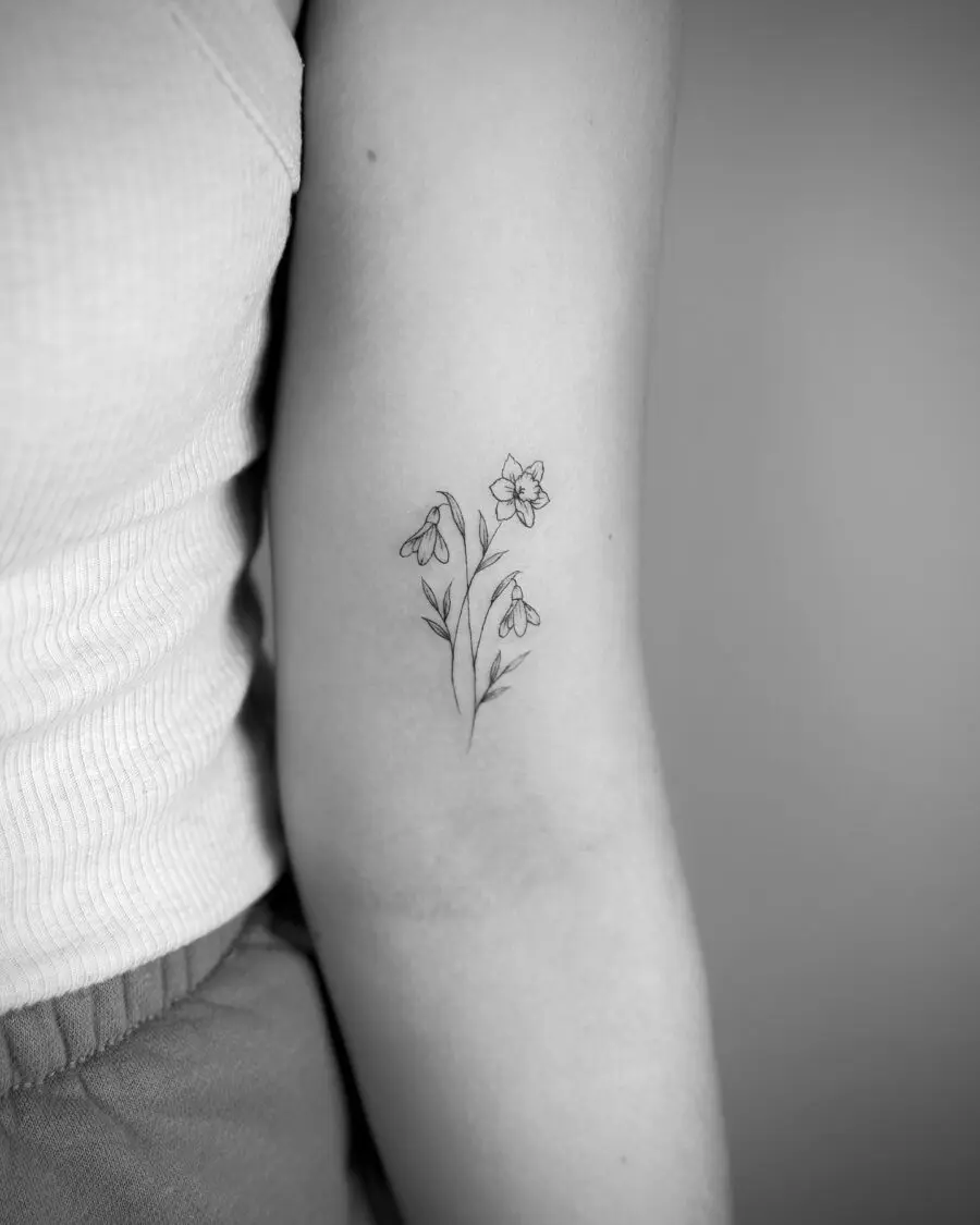 Elegant snowdrop tattoo showcasing minimalist beauty