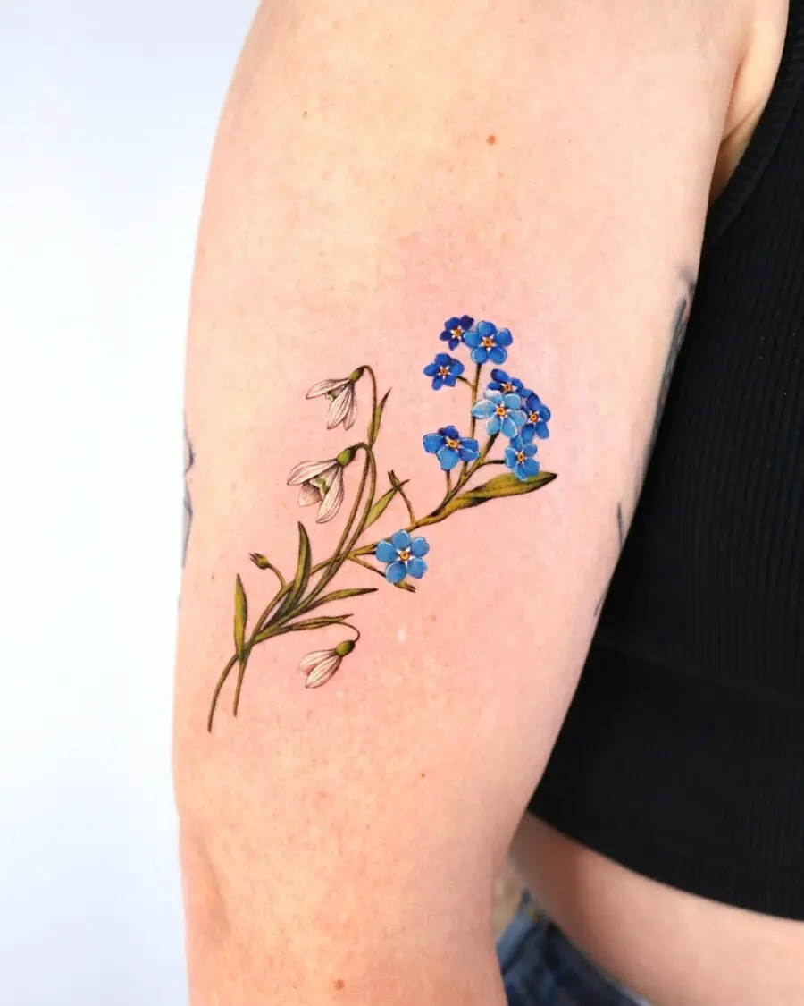 Elegant snowdrop and blue flower tattoo design