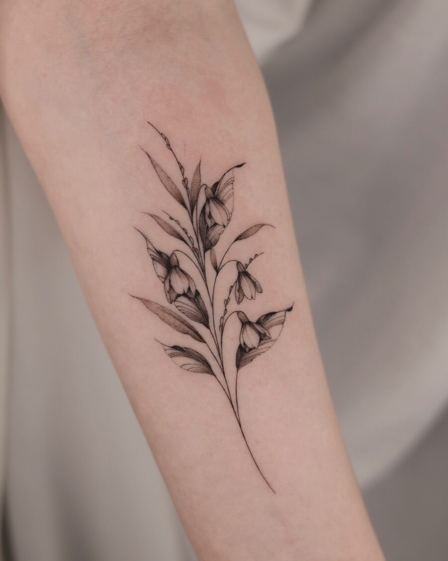Elegant snowdrop tattoo showcasing delicate floral details