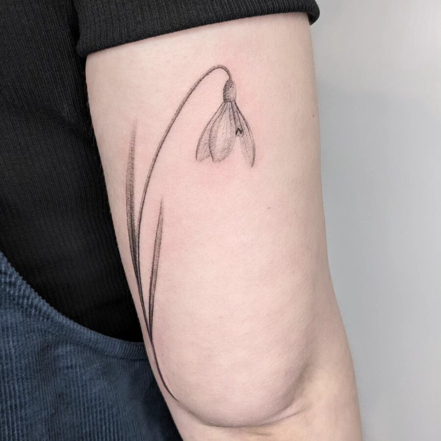 Elegant snowdrop tattoo on the arm