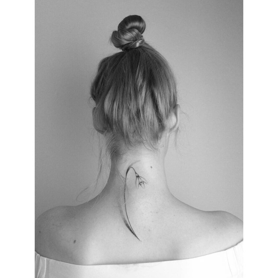 Sleek snowdrop tattoo, subtly stylish vibe