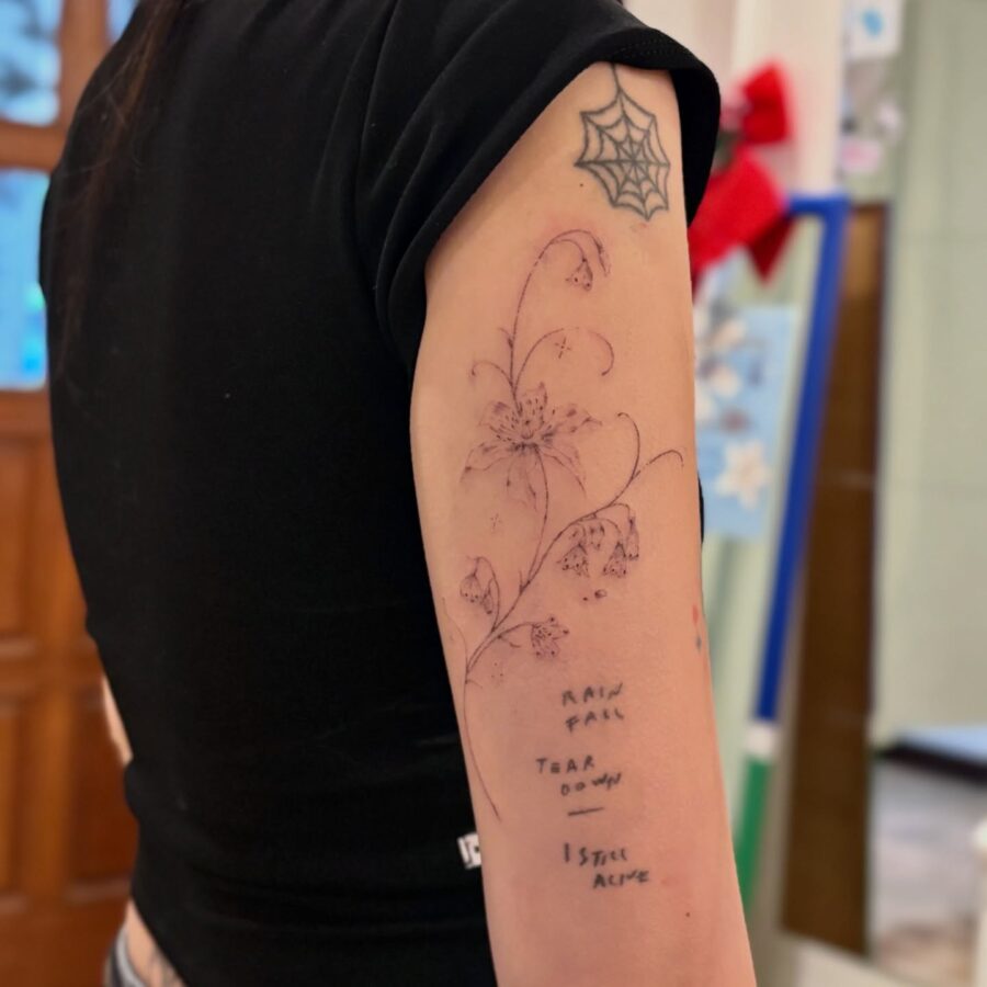 Feminine snowdrop flower tattoo with delicate details