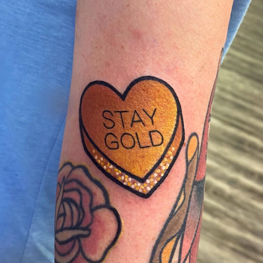 Vibrant Candy Heart Tattoo with a Message