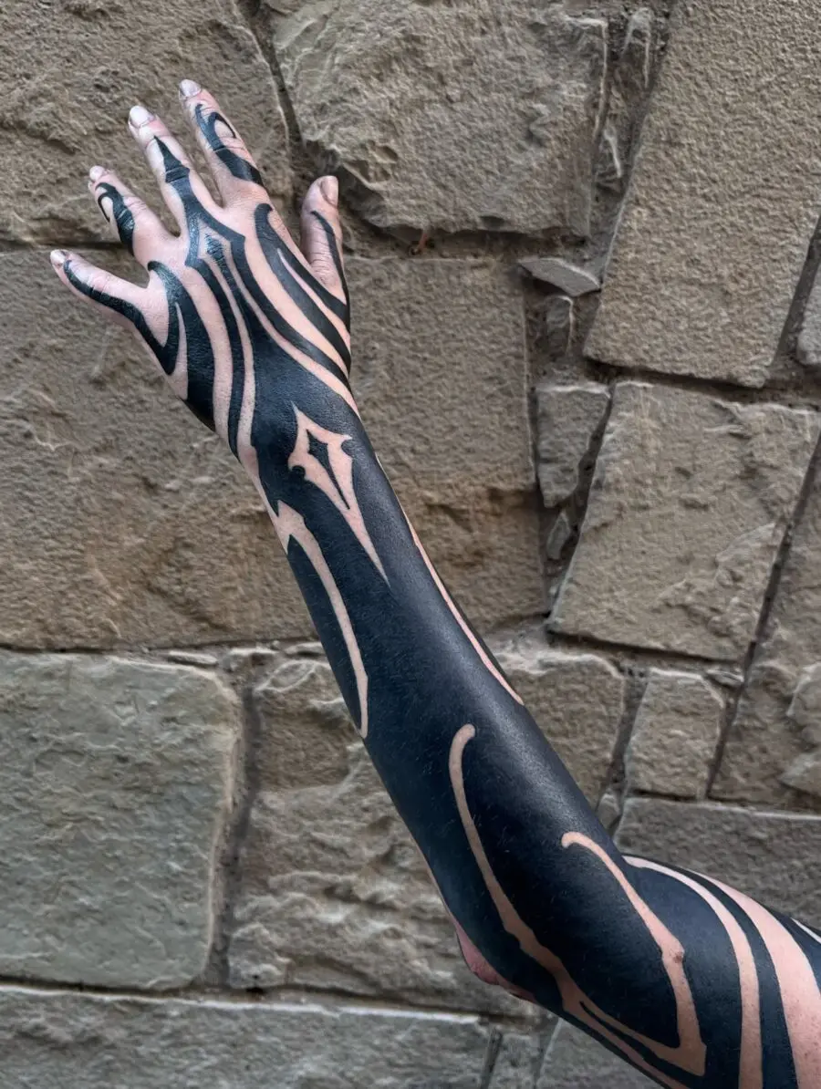 Intricate black sleeve tattoo design showcased