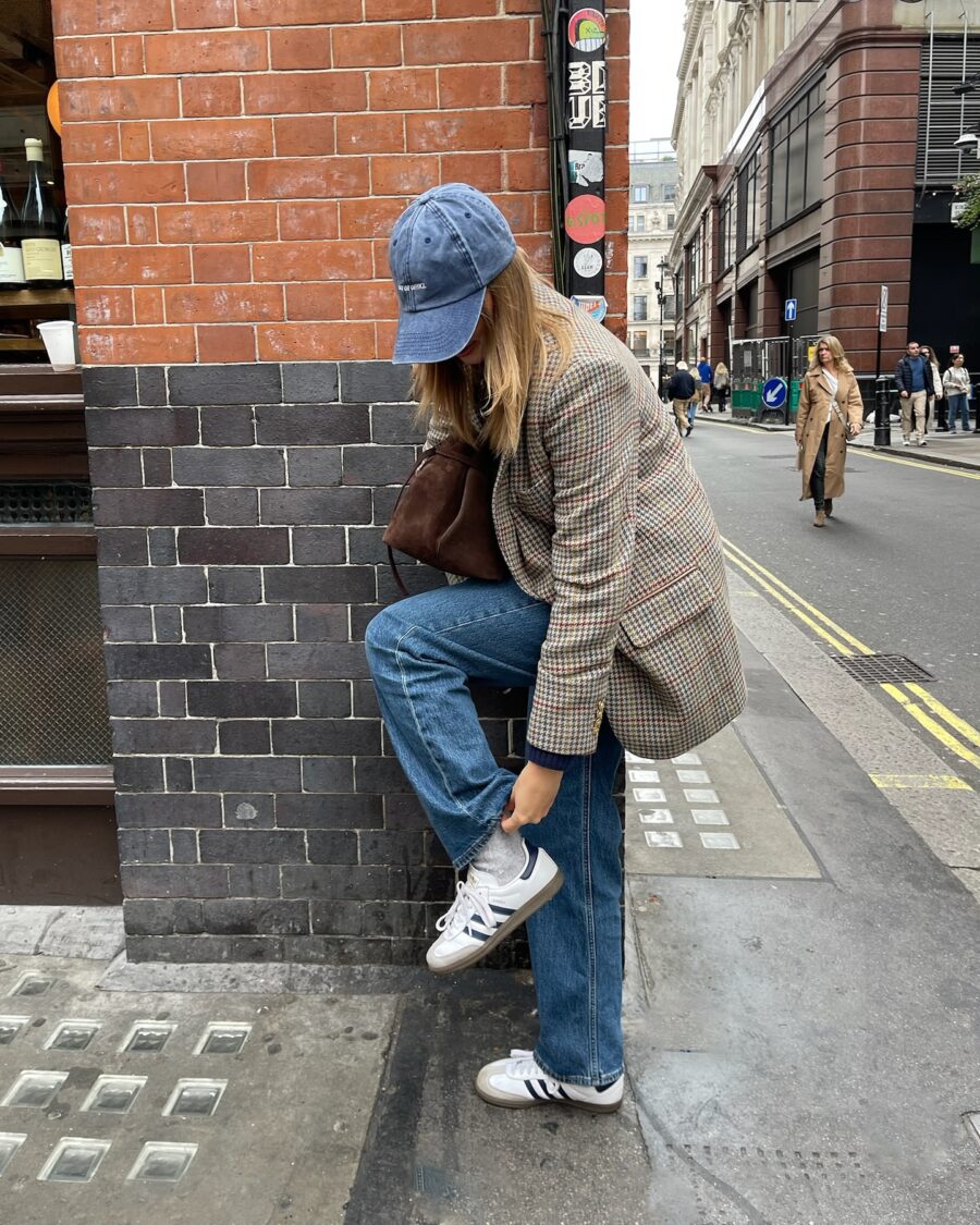 Chic layering with sneakers in an urban setting