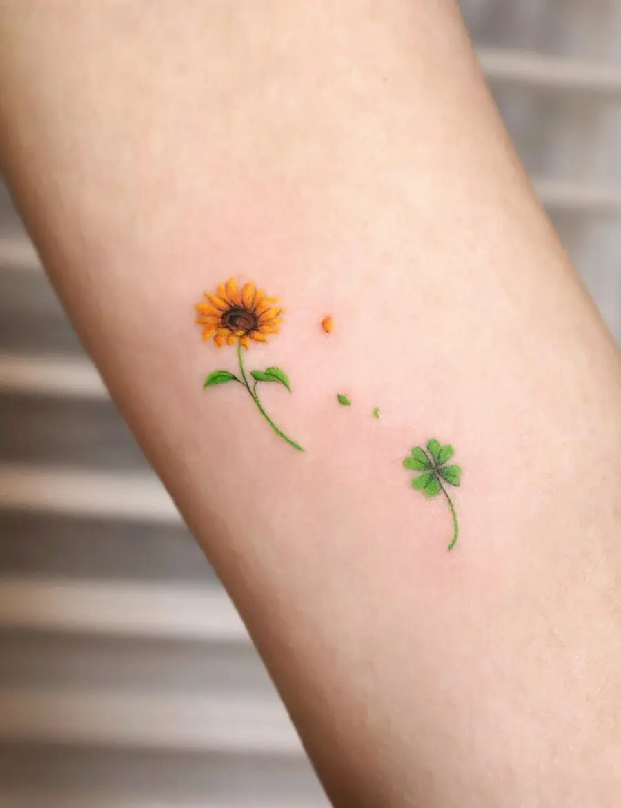 Charming sunflower and clover tattoo design