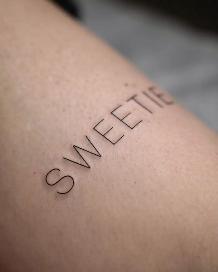 Minimalist tattoo showcasing a sweet sentiment