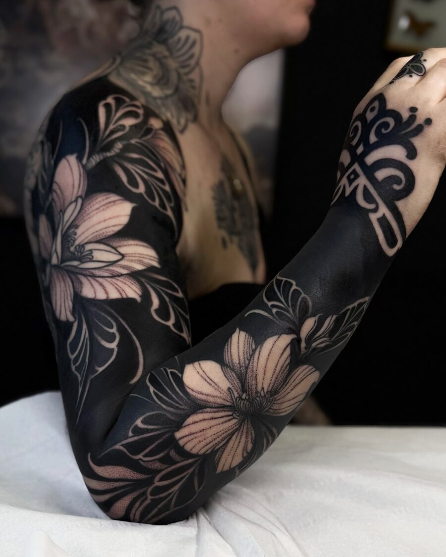 Stunning black floral sleeve tattoo detail