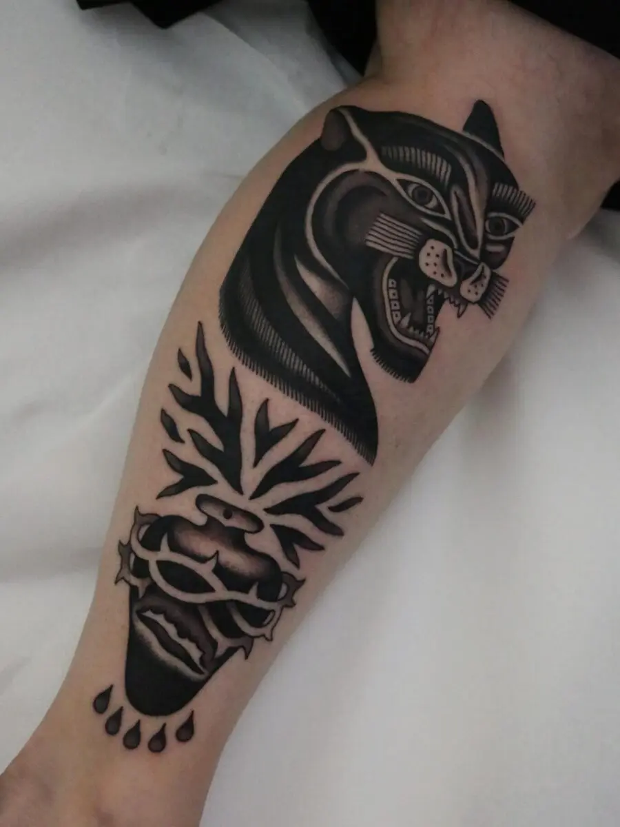 Striking black and gray animal tattoo design.