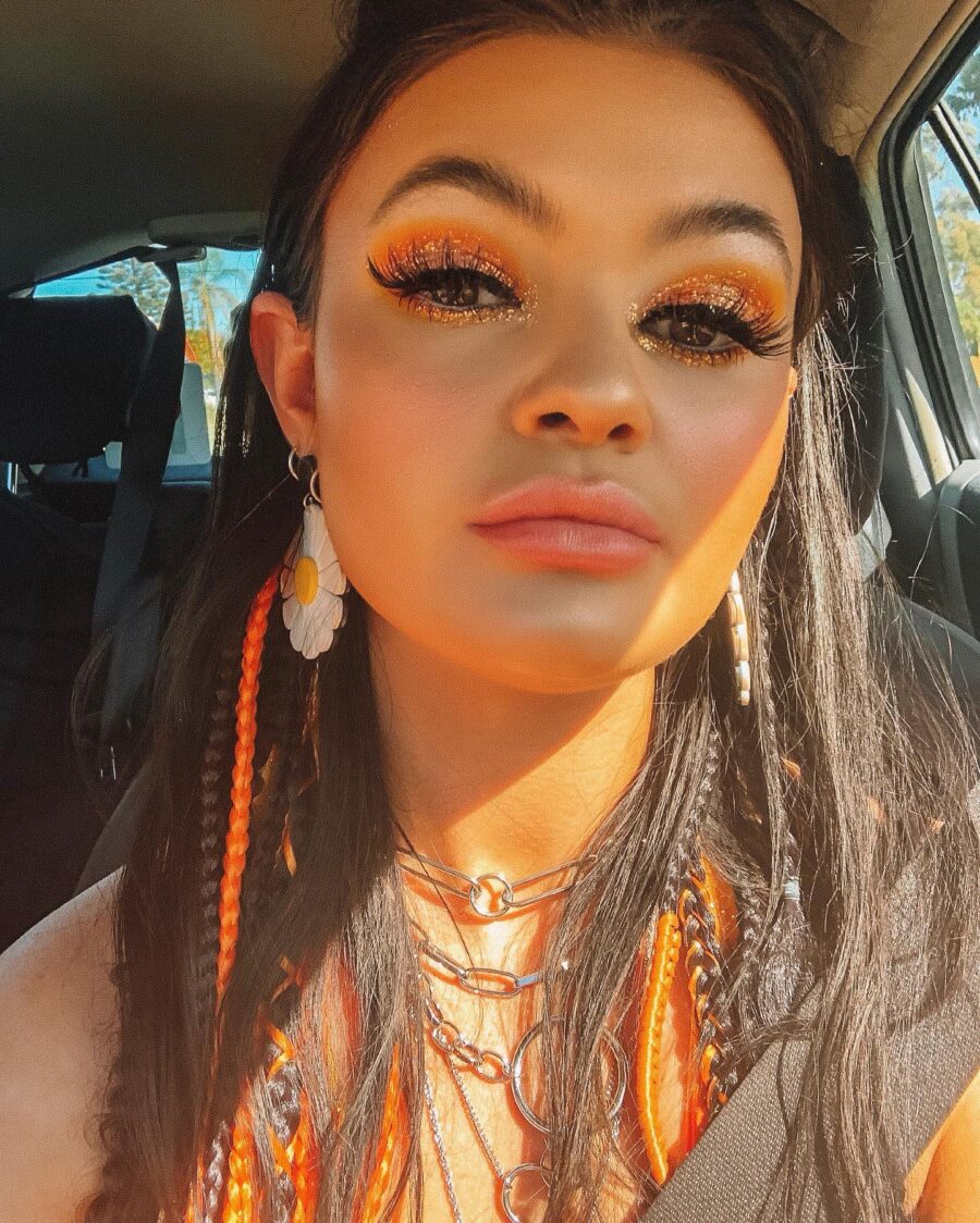Glistening orange lip look for thin lips