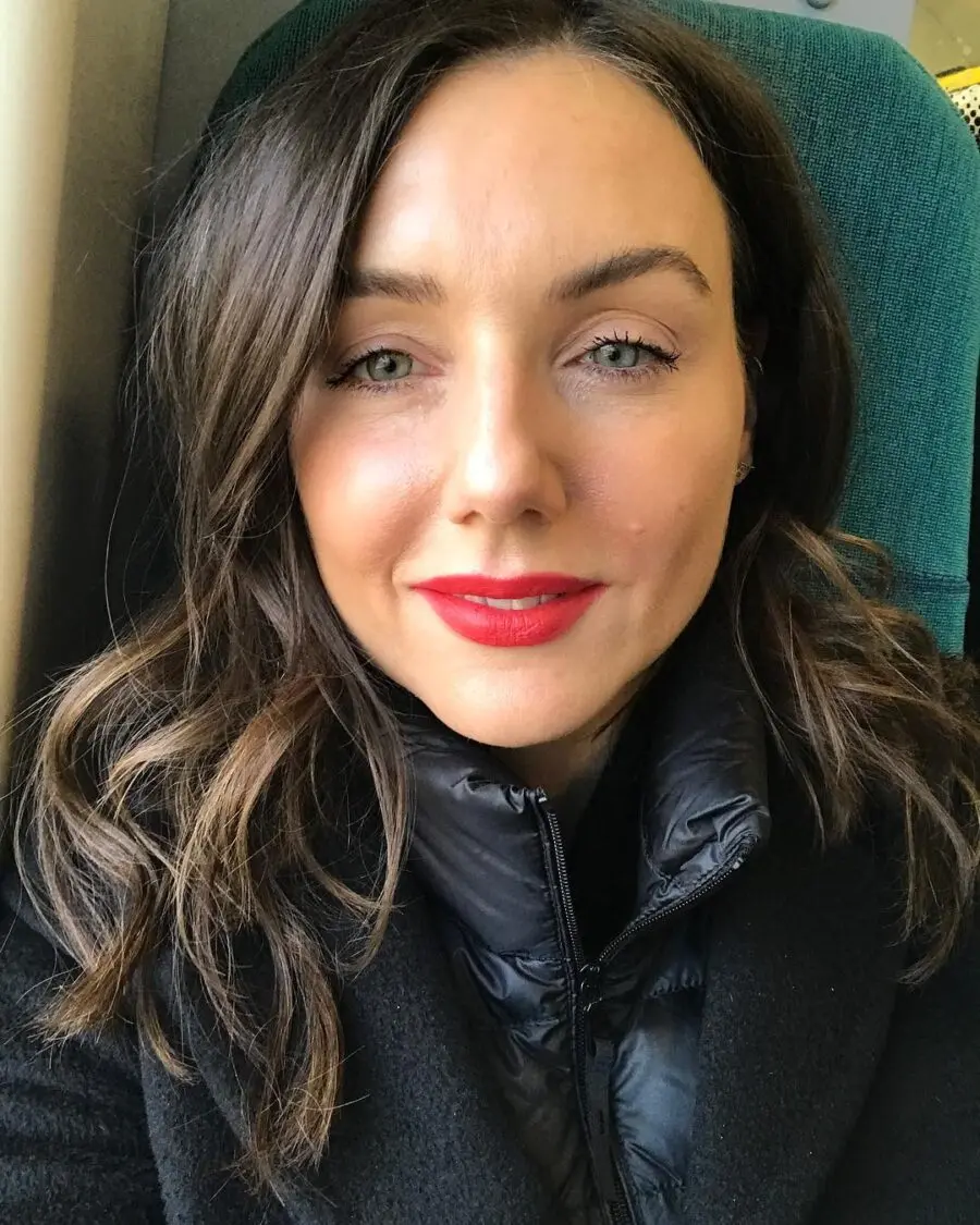 Bold red lips enhance subtle thin features