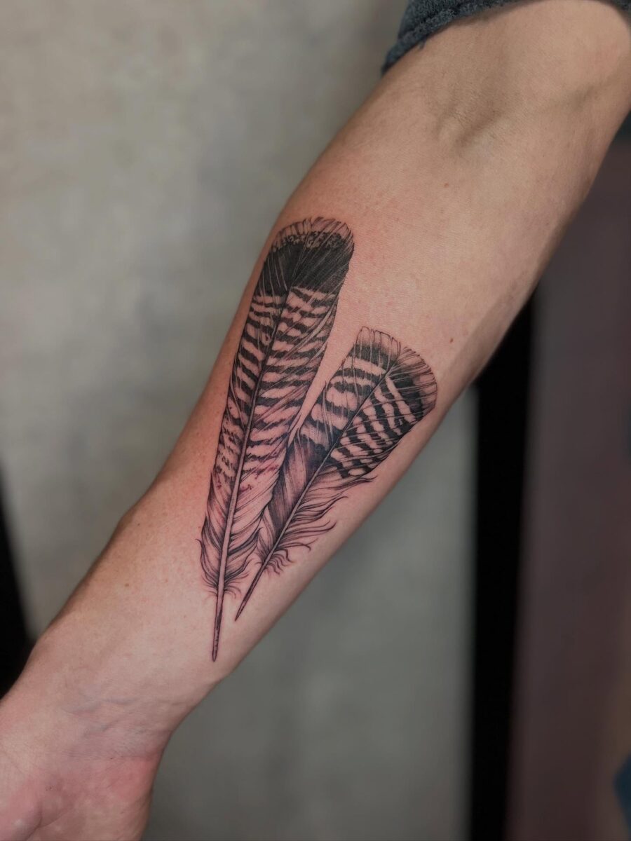 Stunning Turkey Feather Tattoo Design on Forearm