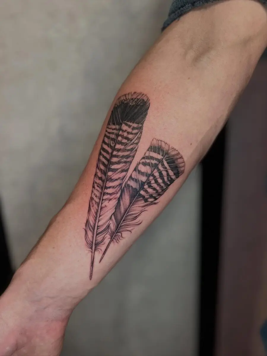 Stunning Turkey Feather Tattoo Design on Forearm