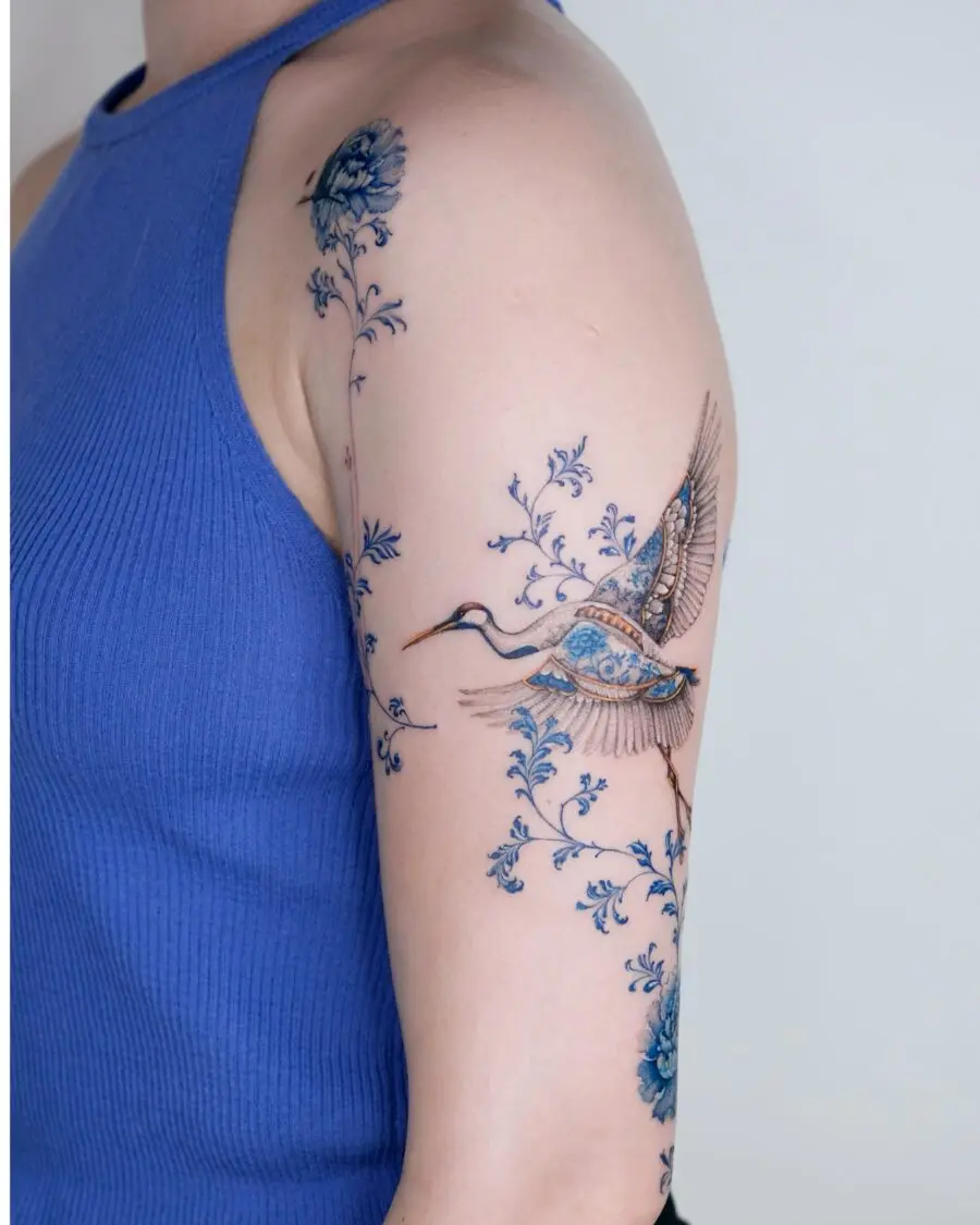 Elegant turkey tattoo featuring vibrant blue elements