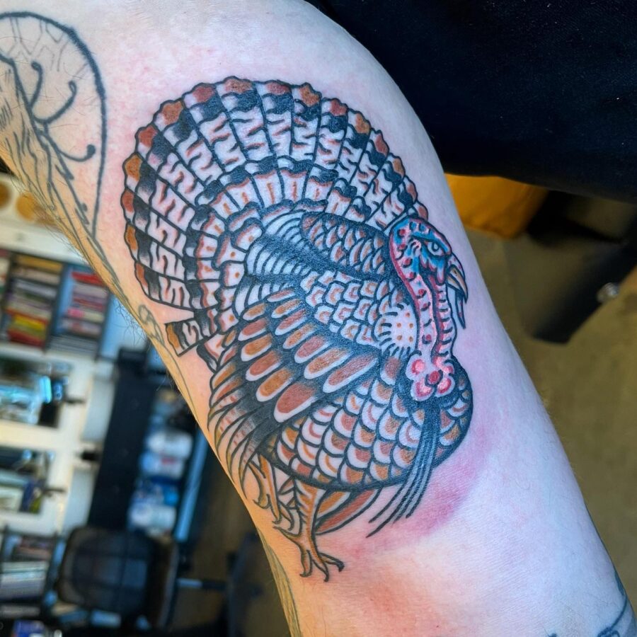 Vibrant turkey tattoo showcasing intricate details