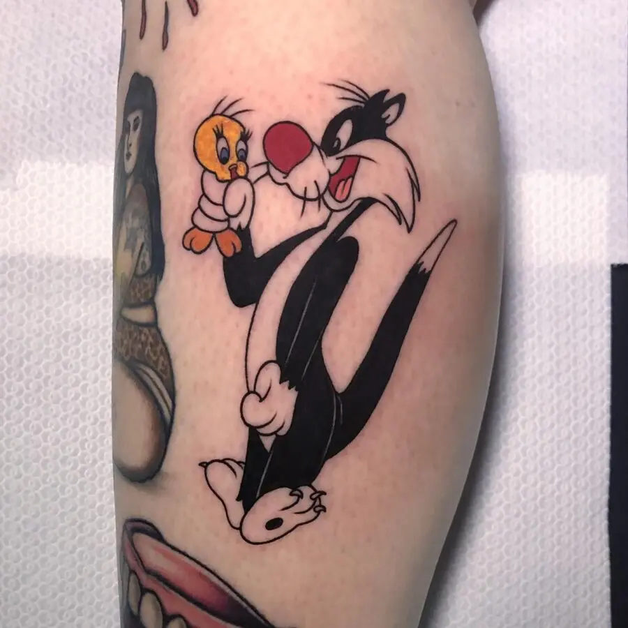 Playful Sylvester and Tweety Tattoo Design