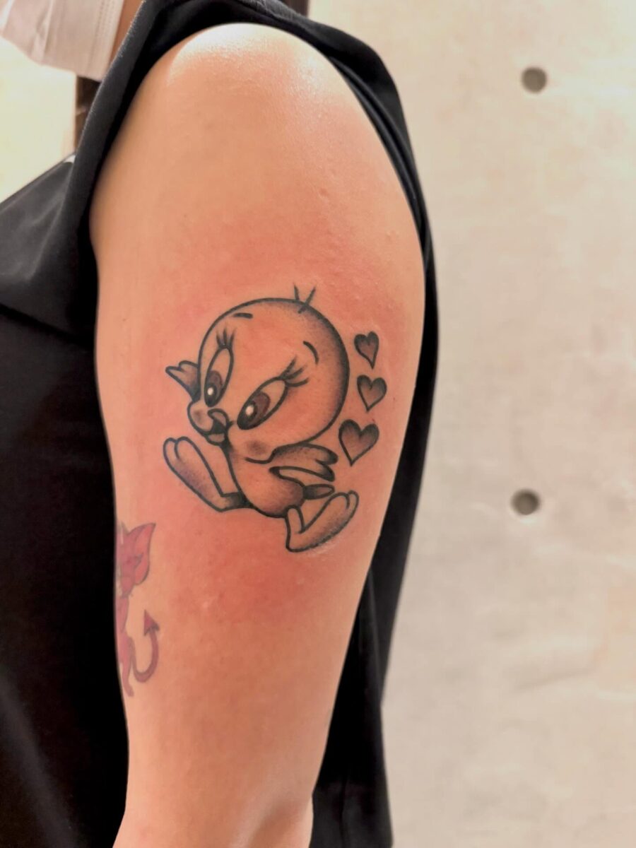 Adorable Tweety Bird with Hearts Tattoo